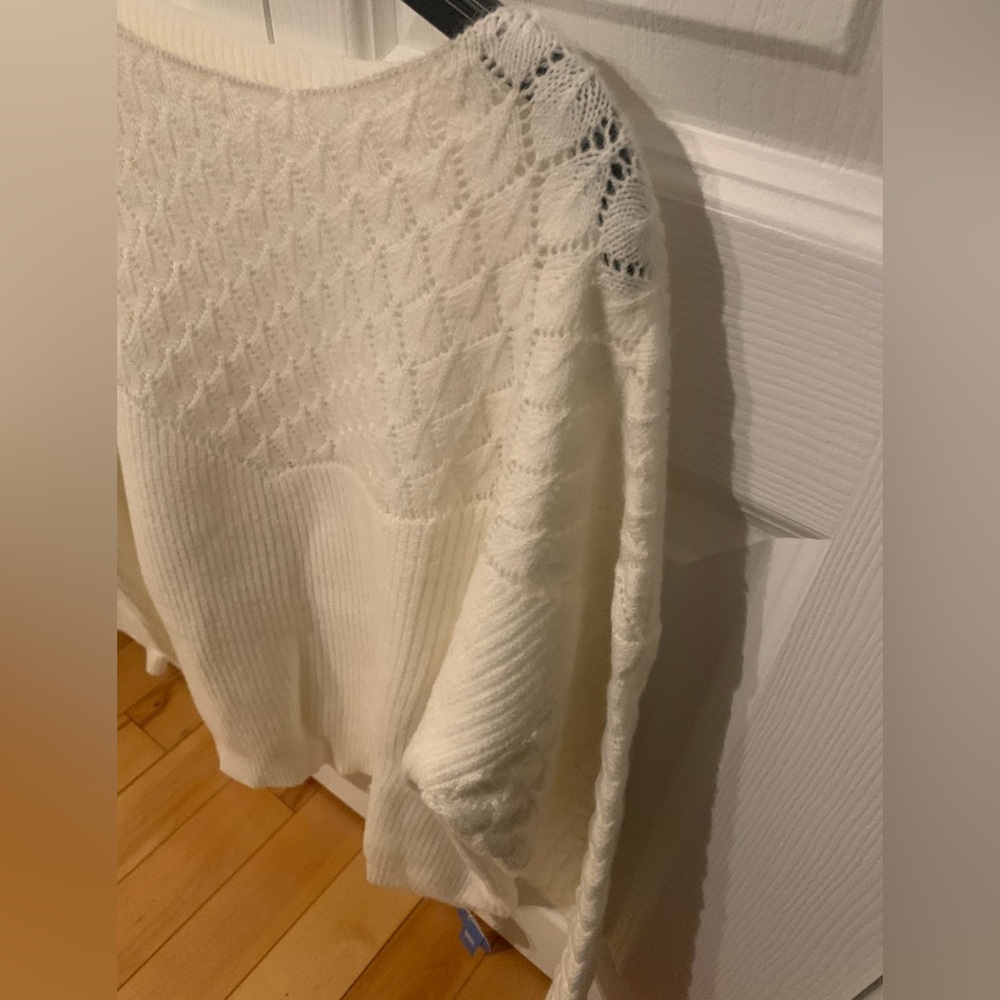 Light knitted top with nice details on top and sleeves, brand new with tags